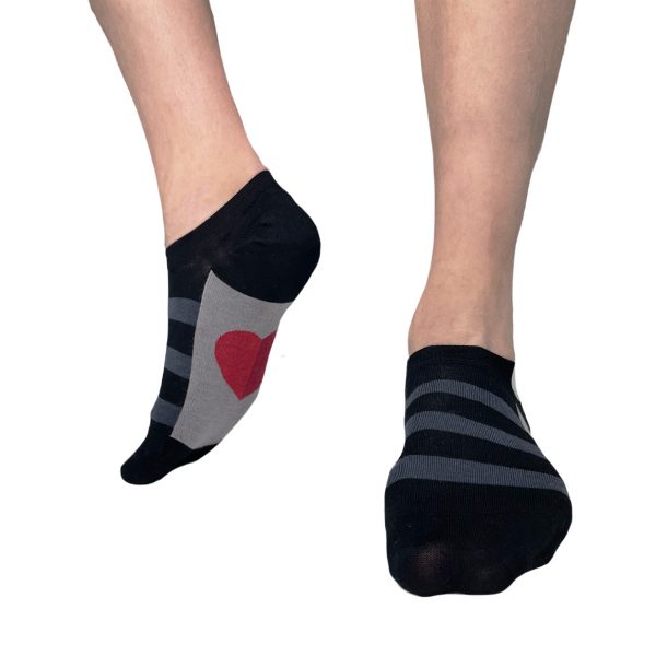 Black sneaker socks with a red heart on the insole
